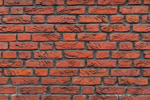Fragment of a red brick wall. Close up. Stock Photos