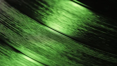 A fragment of a rotating vinyl record in the red rays of a disco Video stock 128642085