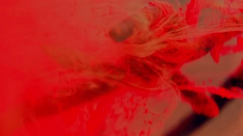 A fragment of rusty barbed wire in a liquid red stream. Stock Footage 193452862