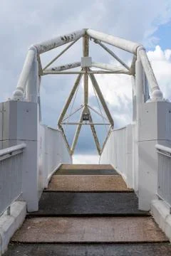 A fragment of a stepped ascent to the pedestrian bridge between the platforms Stock Photos