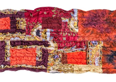 Fragment of stitched red patchwork scarf isolated 스톡 사진