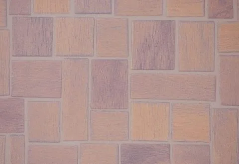 A fragment of a stone mosaic with rectangular elements of different sizes in Foto stock