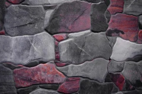 Fragment of stone wall executed from stones of various form and the size. Bac Stock Photos