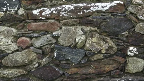 Fragment of a stone wall. The old wall is made of stone. Stock Footage 90073670