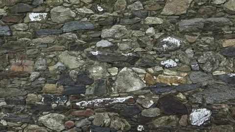 Fragment of a stone wall. The old wall is made of stone. Texture or background. Stock Footage 90167538