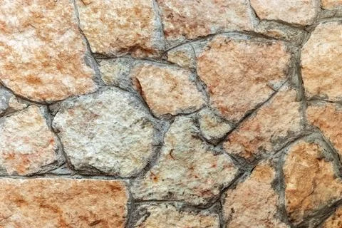 Fragment of a stone wall. Stock Photos