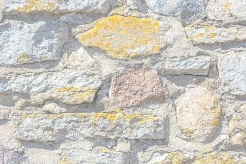 Fragment of a stone wall. Stock Photos