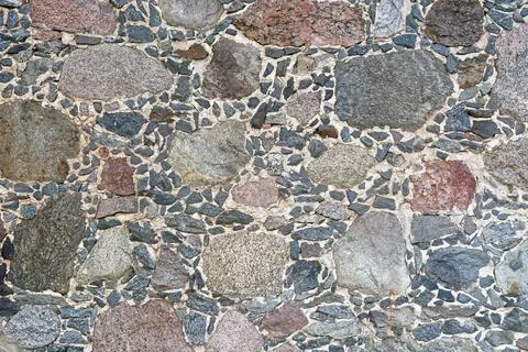 Fragment of a stone wall. Stock Photos