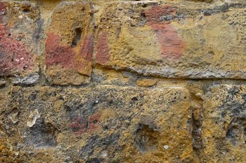 A fragment of the surface of the wall is constructed of stone blocks of vario Stock Photos