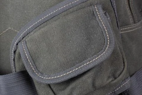 Fragment of a textile backpack. Textured pattern of coarse interwoven threads. Stock Photos