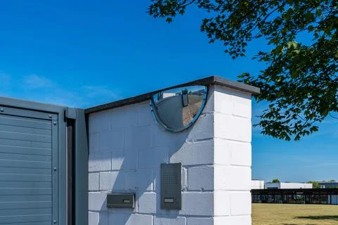 Fragment of wall and gate with intercom and mirror Stock Photos