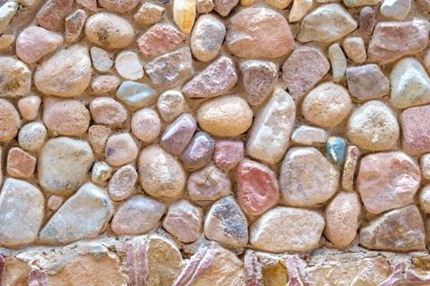 Fragment of a wall from a colour stone background texture photo Stock Photos