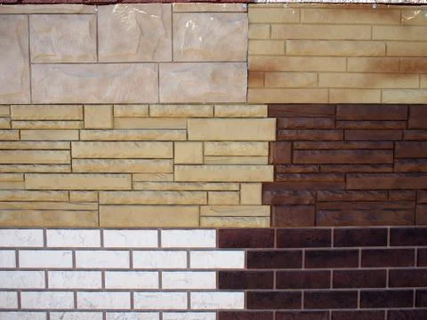 Fragment wall with different types of decorative coating Stock Photos