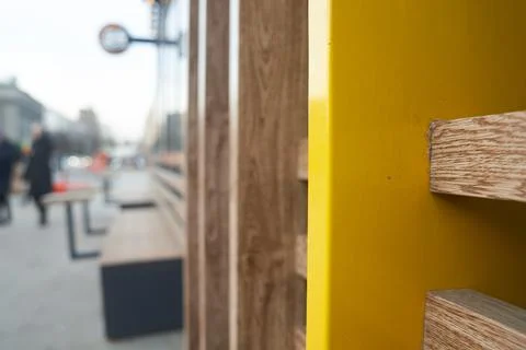 A fragment of a wall at the intersection of several natural-colored boards, a Stock Photos