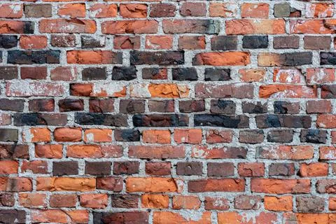 Fragment of a wall made of old bricks. Stock Photos