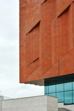 Fragment of the wall of a neo constructivism building made of red brick and g Photos