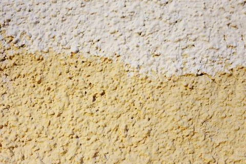 A fragment of a wall painted with two different colors. Stock Photos