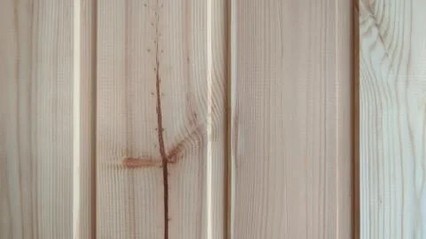 Fragment of a wall of vertical treated pine boards, close-up Stock Photos