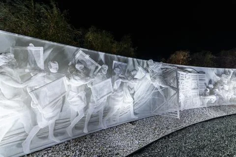 Fragment of white multi-figured bas-relief made of plastic mesh by artists Re Stock Photos