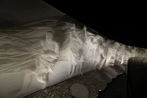 Fragment of white multi-figured bas-relief made of plastic mesh by artists Re Stock Photos