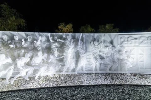 Fragment of white multi-figured bas-relief made of plastic mesh by artists Re Stock Photos
