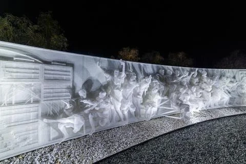 Fragment of white multi-figured bas-relief made of plastic mesh by artists Re Stock Photos