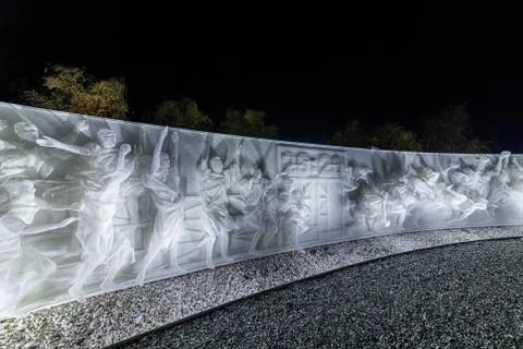 Fragment of white multi-figured bas-relief made of plastic mesh by artists Re Stock Photos
