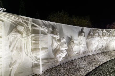 Fragment of white multi-figured bas-relief made of plastic mesh by artists Re Stock Photos