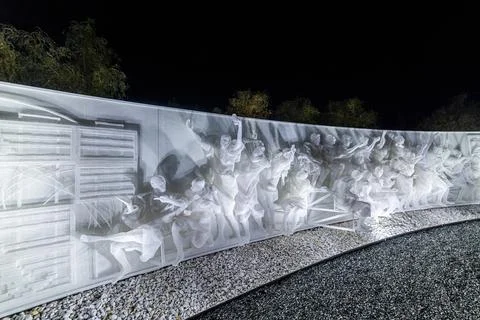 Fragment of white multi-figured bas-relief made of plastic mesh Stock Photos