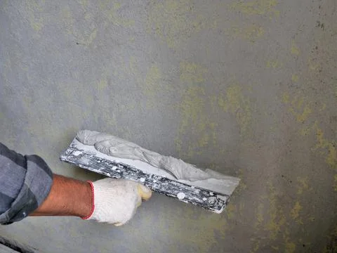 Fragment of the work of the plasterer Stock Photos