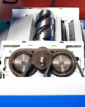 Fragment of the working part of the thicknessing machine for woodworking. 스톡 사진