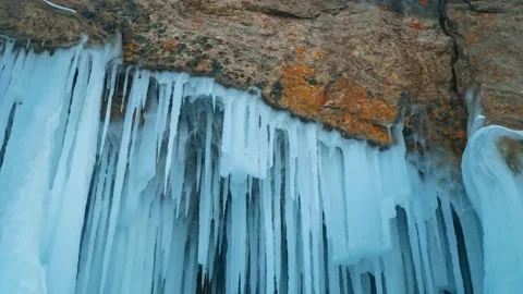 The fragments of icicles hanging from the ceiling of the ice shelter. Winter Stock Footage 228883325