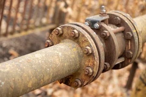 Fragments of old large gas pipe. Stock Photos