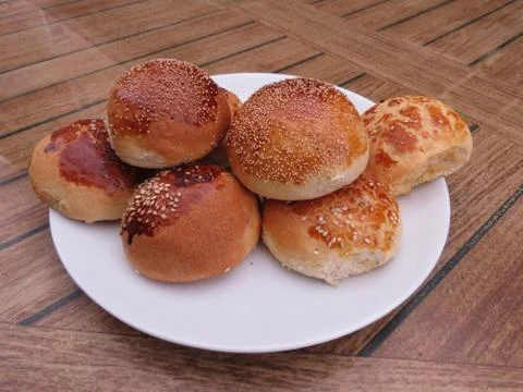 Fragrant bun on a plate Stock Photos