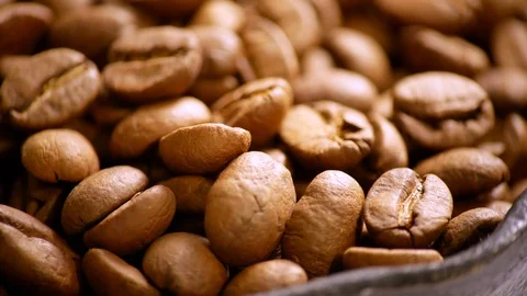 Fragrant coffee beans are roasted in a frying pan. The composition scrolls sl 스톡 동영상 122336291