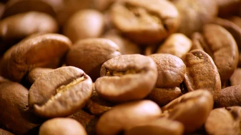 Fragrant coffee beans are roasted in a frying pan. The composition scrolls sl Video stock 122336462
