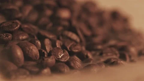 Fragrant coffee beans are roasted in a frying pan, smoke comes from coffee beans Stock Footage 138869565