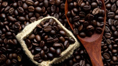 Fragrant coffee beans are roasted in a frying pan, smoke comes from coffee beans 스톡 동영상 172385813