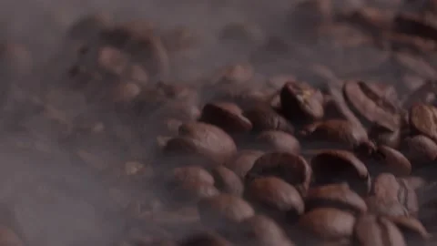 Fragrant coffee beans are roasted smoke comes from coffee beans. Stock Footage 199472689