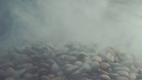 Fragrant coffee beans roasting. Roasting pile of coffee beans. Coffee seeds with Stock Footage 149411435