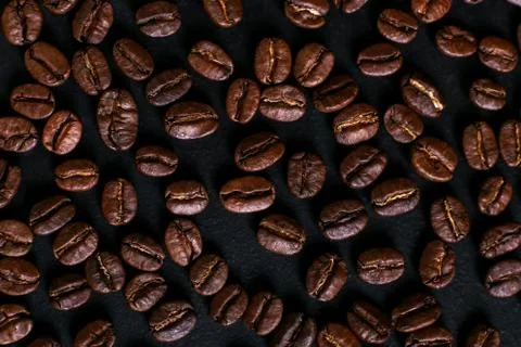 Fragrant coffee beans on rustic tabletop background. Banner copy space. Stock Photos