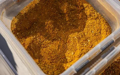 Fragrant colored bulk spices by weight. Loose red, yellow and green spices. C Stock Photos