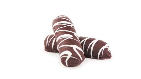 Fragrant cookies of choux pastry in dark chocolate covered 360 degree turning on Stock Footage 74475498