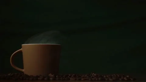 A fragrant cup of coffee smokes on the table Stock Footage 184157525