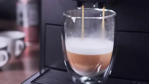 Fragrant flat white is prepared in a coffee machine. Stock Footage 161161533