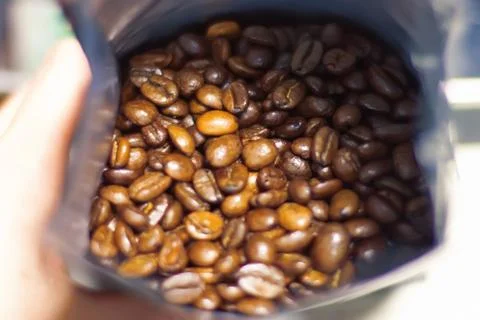Fragrant fried coffee beans.  in the package Stock Photos
