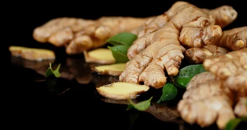 Fragrant ginger root with leaves rotates... | Stock Video | Pond5