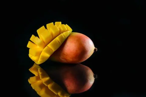 Fragrant mango on glass Stock Photos