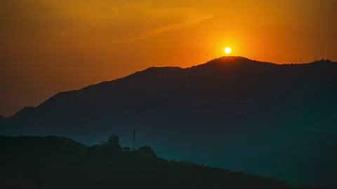 Fragrant mountain sunset sun slowly setting Stock Footage 210537252