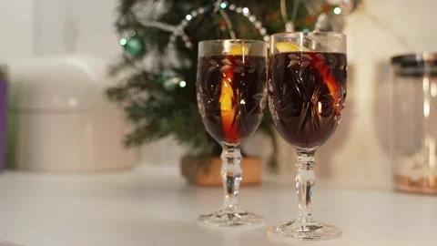 Fragrant mulled wine on the background of a Christmas tree Stock Footage 255375452